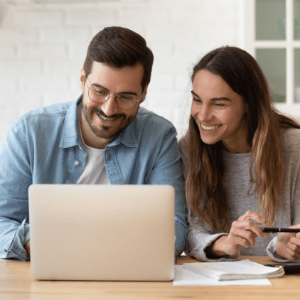 A couple looking at a laptop