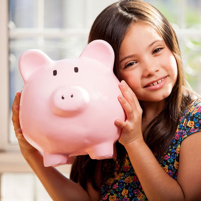 Kid with a piggy bank