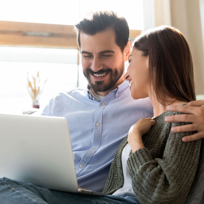 A couple reviewing their account via online banking
